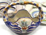 many plates and bowls that are sitting on a table