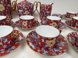 a lot of cups and saucers that are on the table