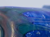 a close up view of a blue and green object