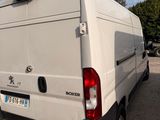 a white van that is parked in a parking lot