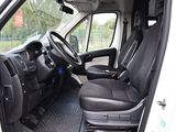 a white van with black seats and a steering wheel