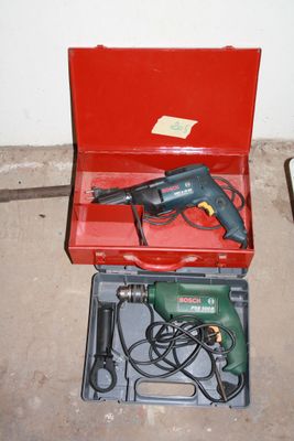 a red box with a drill and a cord in it