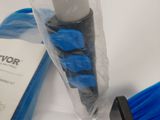 a blue brush and a book sitting on a table