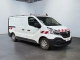 the white van is parked in a large room with a red and white stripe