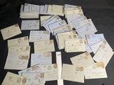 a pile of old letters and envelopes on a table