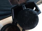 a coffee maker sitting on top of a wooden table