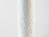 a white vase that has a rope on it