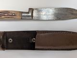 two knives that are sitting next to each other on a table