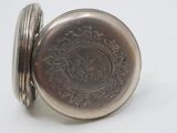 silver pocket watch on white background with silver case