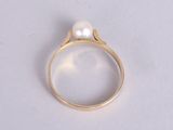 an image of a ring with a pearl in it