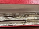 a set of silverware in a red box on a table