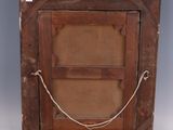 an old wooden picture frame with a rope hanging from it