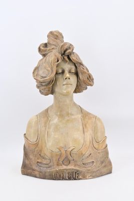 statue of a woman with a hat on her head and a flower in her hair
