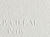 a close up of a piece of white paper with the words spaldem paris on it