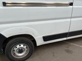 a white van that is parked in a parking lot