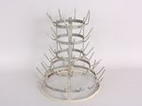a picture of a metal wine rack on a white surface