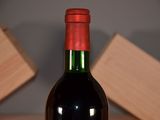 a bottle of wine that is sitting on a table
