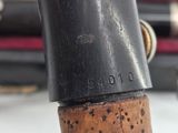 a close up of a sewing machine with a cork stopper