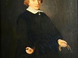 portrait of a young man in a black dress with a white collar