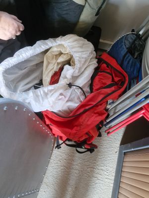 a person sitting on a couch with a bag of luggage