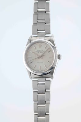 an image of a silver watch with a white dial on a silver bracelet