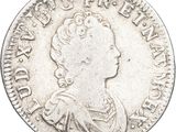 gros plan d'une pièce de monnaie sur fond blanc
