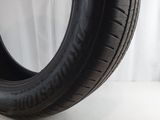 a close up of a tire on a white surface with a white background