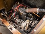 a close up of a small engine in a wooden box