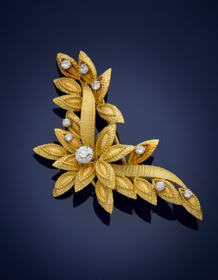a gold and diamond broochle, by van cleef