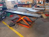an image of a workbench in a garage with tools