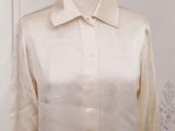an image of a white shirt on a mannequin stand