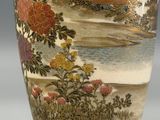 a vase with a painting of birds and flowers on it