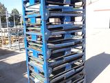 an image of a stack of metal trays on a pallet