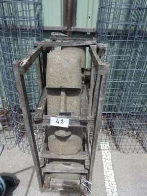 a metal cage that has a toilet in it