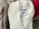several towels are stacked on top of each other in a pile
