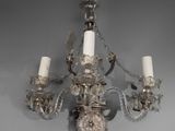 a chandelier that is hanging from the ceiling