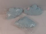 three pieces of blue soap sitting on a white surface