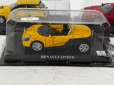 three toy cars in a display case on a table