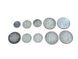 a lot of coins that are on a white surface