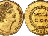 a gold coin with a woman ' s head and a wreath on it