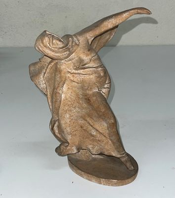 a statue of a woman with a hat on her head