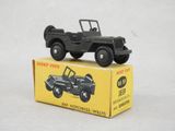 a black toy jeep sitting on top of a yellow box