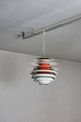 a light that is hanging from the ceiling in a room