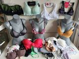 several mannequins with bras and bra tops on display in a store