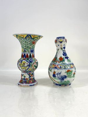 two vases sitting next to each other on a table