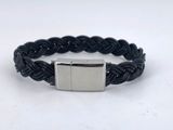 a black braid bracelet with a silver clasp