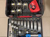 a tool box with tools in it sitting on the floor