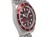 rolex submarine red dial watch on a stainless steel bracelet