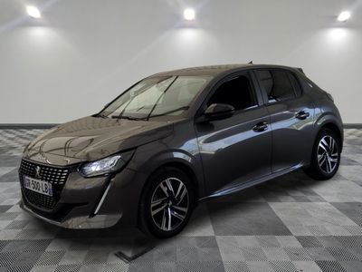 the grey car is parked on a checkered floor in the garage