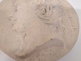 a close up of a clay bust of a woman